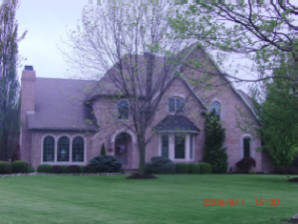 brick home sandstone window accents